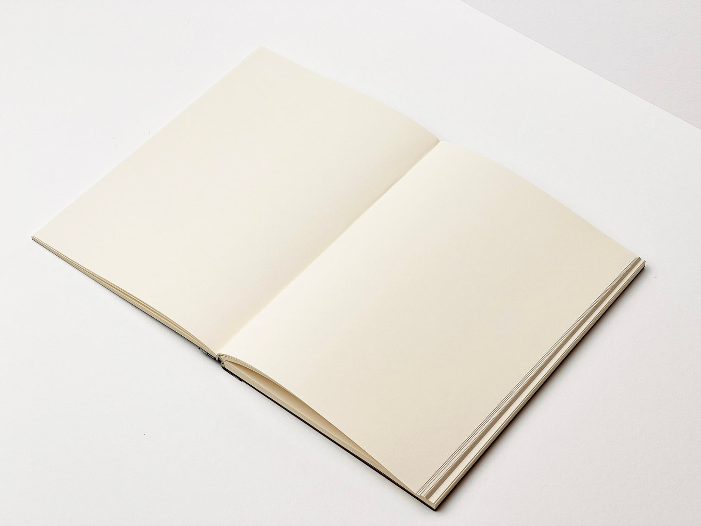 an open book sitting on top of a white table