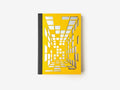A sketchbook with a yellow cover featuring a geometric isometric design, indicating a focus on perspective layout, suitable for architects and designers.